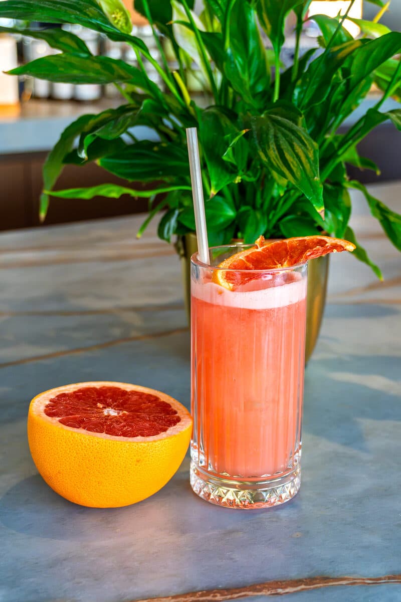 Fresh grapefruit juice in a cut glass, on the marble counter